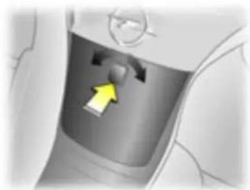 Close-up of a car interior showing a highlighted seat area with a yellow arrow pointing to the seat (no text or symbols visible)