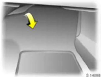 Close-up of a car interior showing a yellow arrow pointing to the side panel (no text or symbols visible)