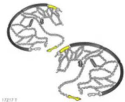 Two identical circular diagrams with internal mechanical or electrical components, no visible text or symbols