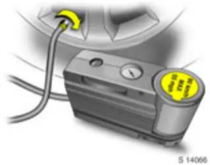 Close-up of a mechanical device with wires and a yellow circular dial, no visible text or symbols