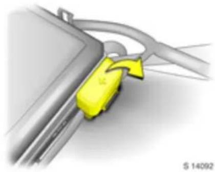 Close-up of a car fuel nozzle with a yellow plastic clip attached, no visible text or symbols