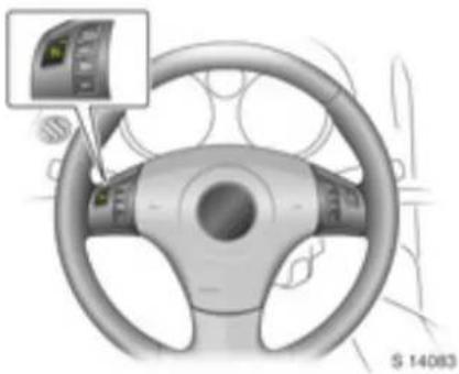 Interior view of a car steering wheel with a digital display showing the dashboard (no text or symbols on the wheel itself)