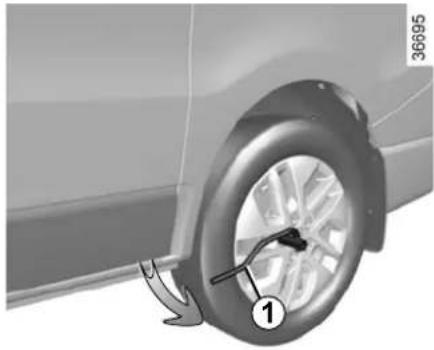 Close-up of a car wheel rim with a numbered component and directional arrow.
