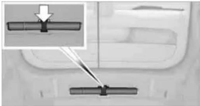 Diagram showing two mechanical components with arrows indicating movement or force, no visible text or symbols