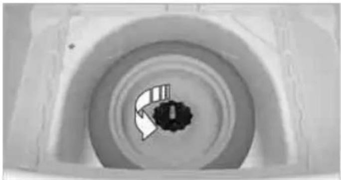 Top-down view of a circular mechanical component with concentric rings and a central dark hole (no text or symbols visible)