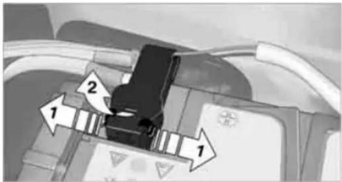 Diagram showing a device with labeled parts and directional arrows indicating flow or movement