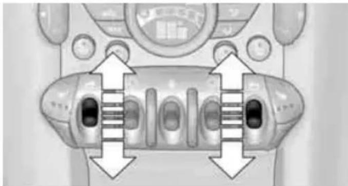 Top-down view of a vehicle's front panel showing internal components and directional arrows (no text or symbols)