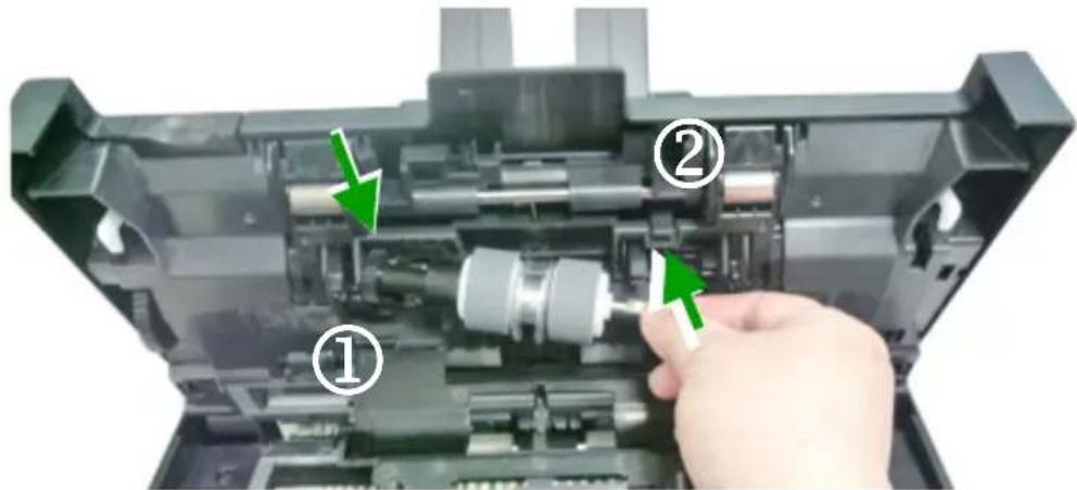 Diagram of a device's internal structure with labeled parts (① and ②) and green arrows indicating assembly or operation.