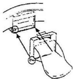 Diagram of a mechanical device with arrows indicating motion or force direction (no text or symbols)