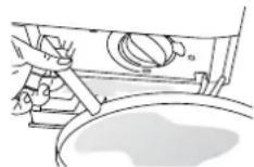 Line drawing of a hand pressing a button on a rectangular panel (no text or symbols).