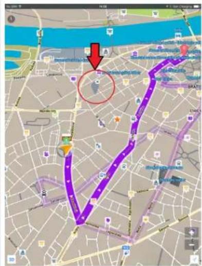 Map screenshot showing a purple route with a red circle highlighting a specific area, and a red arrow pointing to a location marker.