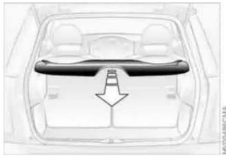 Top-down view of a car interior showing the rear wheel, dashboard, and seat area with a downward arrow indicating airflow or pressure (no text or symbols)