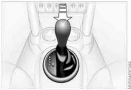 Close-up of a robotic hand holding a keychain, with no visible text or symbols
