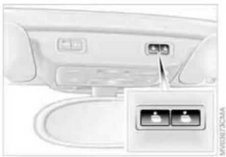 Interior view of a car rear panel showing a button labeled 'VACC/IRAM' and two buttons inside (no text or symbols on the main body)