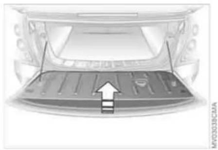 Top-down view of a car trunk with visible structural elements and an arrow indicating a specific area (no text or symbols)