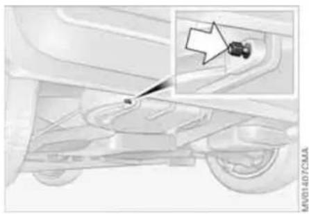 Mechanical component diagram showing a car's base with a highlighted section and an arrow pointing to a small component (no text or symbols present)