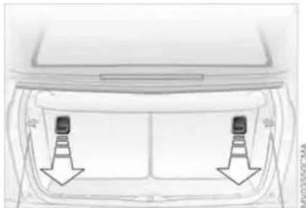 Top-down view of a car backrest with two side-mounted sensors and directional arrows indicating movement (no text or symbols)