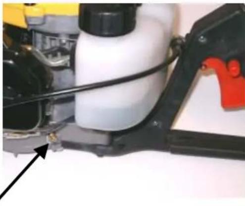Close-up of a spray bottle component with black plastic and red rubber, no visible text or symbols