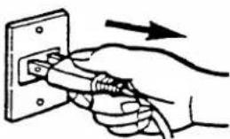 Hand holding a cable inserted into an electrical outlet, with an arrow indicating direction (no text or symbols)