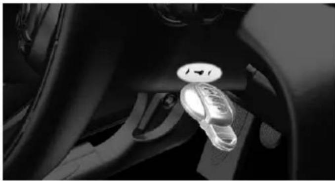Close-up of a car's steering wheel and dashboard with a highlighted circular component (no visible text or symbols)