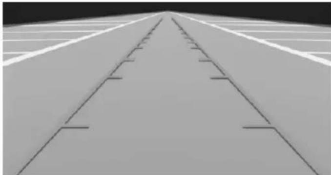 Aerial view of a long elevated road with parallel tracks, no visible text or symbols.