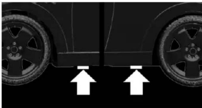 Side view of a car showing two wheels with white arrows pointing upward (no text or symbols)