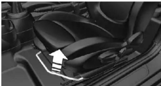 Close-up of a car seatbelt with a white arrow pointing to the seat area (no text or symbols visible)