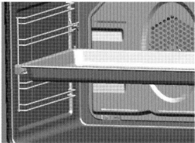 Close-up of a mechanical component with grid lines and a central shaft (no visible text or symbols)