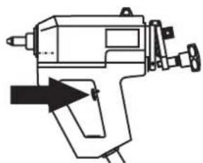 Line drawing of a mechanical tool or device with an arrow pointing to a component (no text or symbols present)
