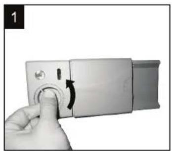 Hand pressing a button on a silver device with a scroll wheel (no text or symbols visible).