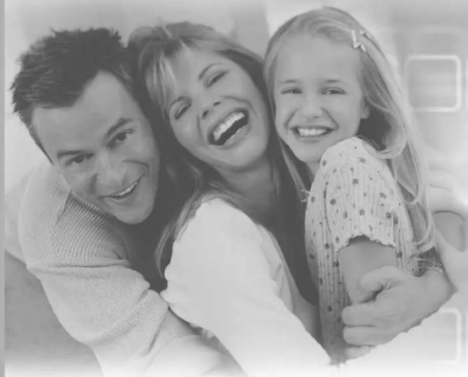Black-and-white photo of a smiling family with three members (two adults and one child) embracing, no text or symbols visible.