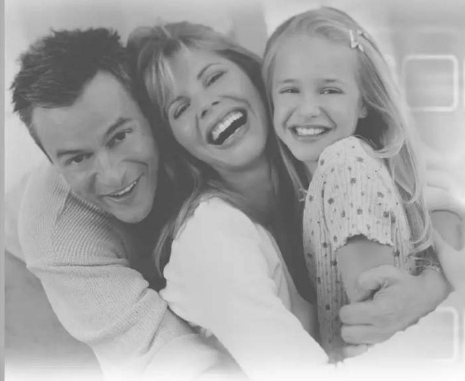 Black-and-white photo of a smiling family with three members (two adults and one child) embracing, no text or symbols visible.