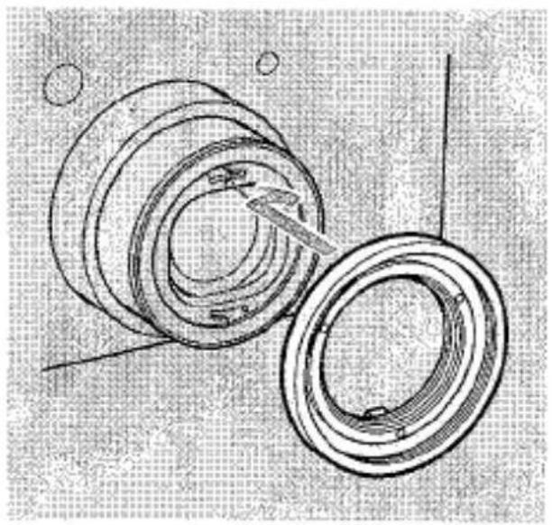 Dessin technique au trait d'un composant mécanique avec des anneaux concentriques et un outil, sans texte ni symboles visibles