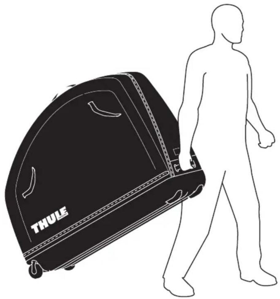 Silhouette of a person walking beside a large black THULE luggage bag (no text or symbols on the bag itself)