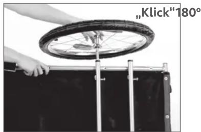 Person using a wheelwheel to lift a black plastic tray, no text or symbols visible