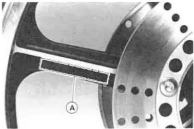Close-up of a mechanical component with flanged ends and a labeled section A (no readable text or symbols)