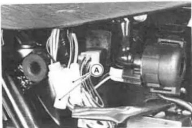 Interior view of a vehicle's engine bay with visible components and wiring (no text or symbols)