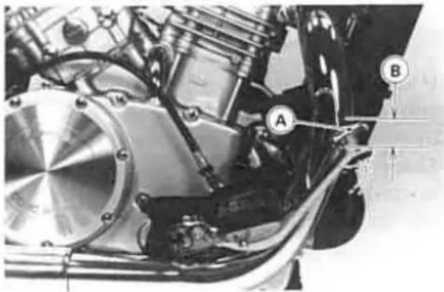 Close-up mechanical assembly showing internal components and labeled parts (A, B), no readable text or symbols beyond labels