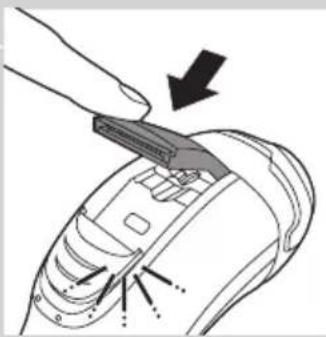 Diagram of a device being inserted into a component, showing a tool and arrow indicating direction (no text or symbols present)