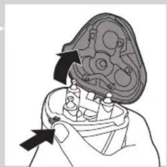 Illustration of a hand holding a dental implant component with arrows indicating direction (no text or symbols)