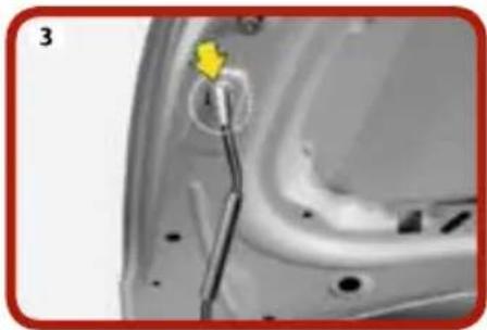 Close-up of a car door panel with a yellow arrow pointing to a component (no visible text or symbols)