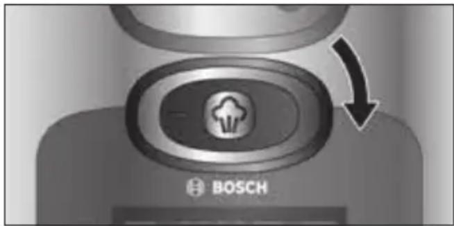Close-up of a Bosch brand button with an arrow indicating rotation (no text or symbols on the button itself)