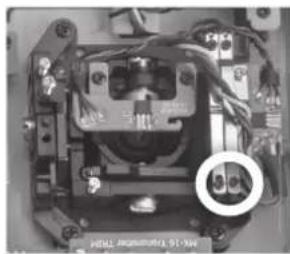 Close-up of an electronic component with visible wiring and a circular annotation (no readable text or symbols)