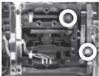 Close-up of an electronic component with visible wiring and mounting holes (no text or symbols)