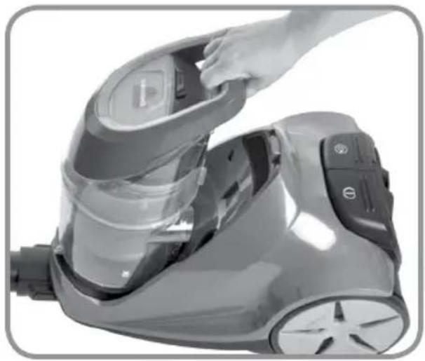 Close-up of a hand adjusting a vacuum cleaner's airbag (no visible text or symbols)