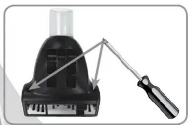 Diagram of a screwdriver inserting into a black plastic component (no text or symbols)