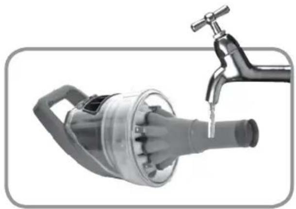 Close-up of a metallic electric shaver with a faucet inserted, no visible text or symbols