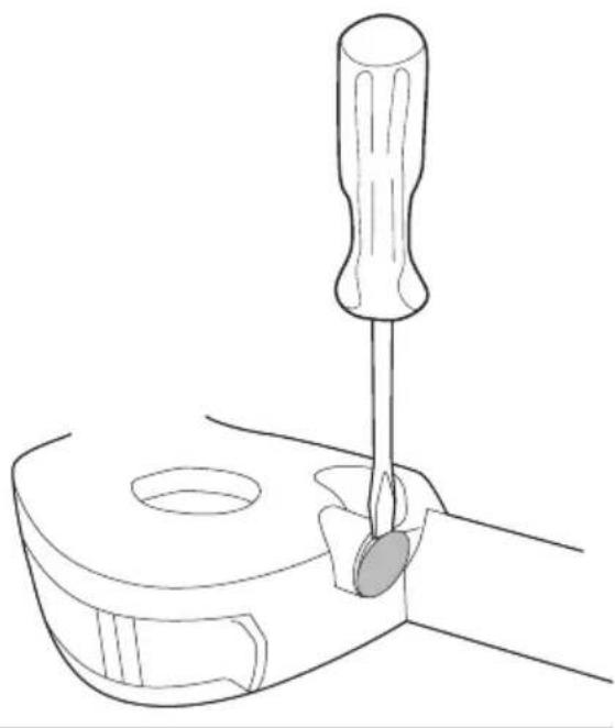 Line drawing of a screwdriver inserted into a mechanical component (no text or symbols)