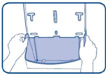 Illustration of hands holding a device with a tray and buttons (no text or symbols)