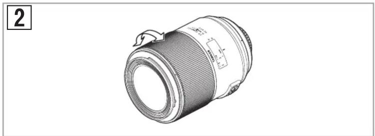 Technical line drawing of a cylindrical lens with adjustable aperture and adjustment arrows (no text or symbols)